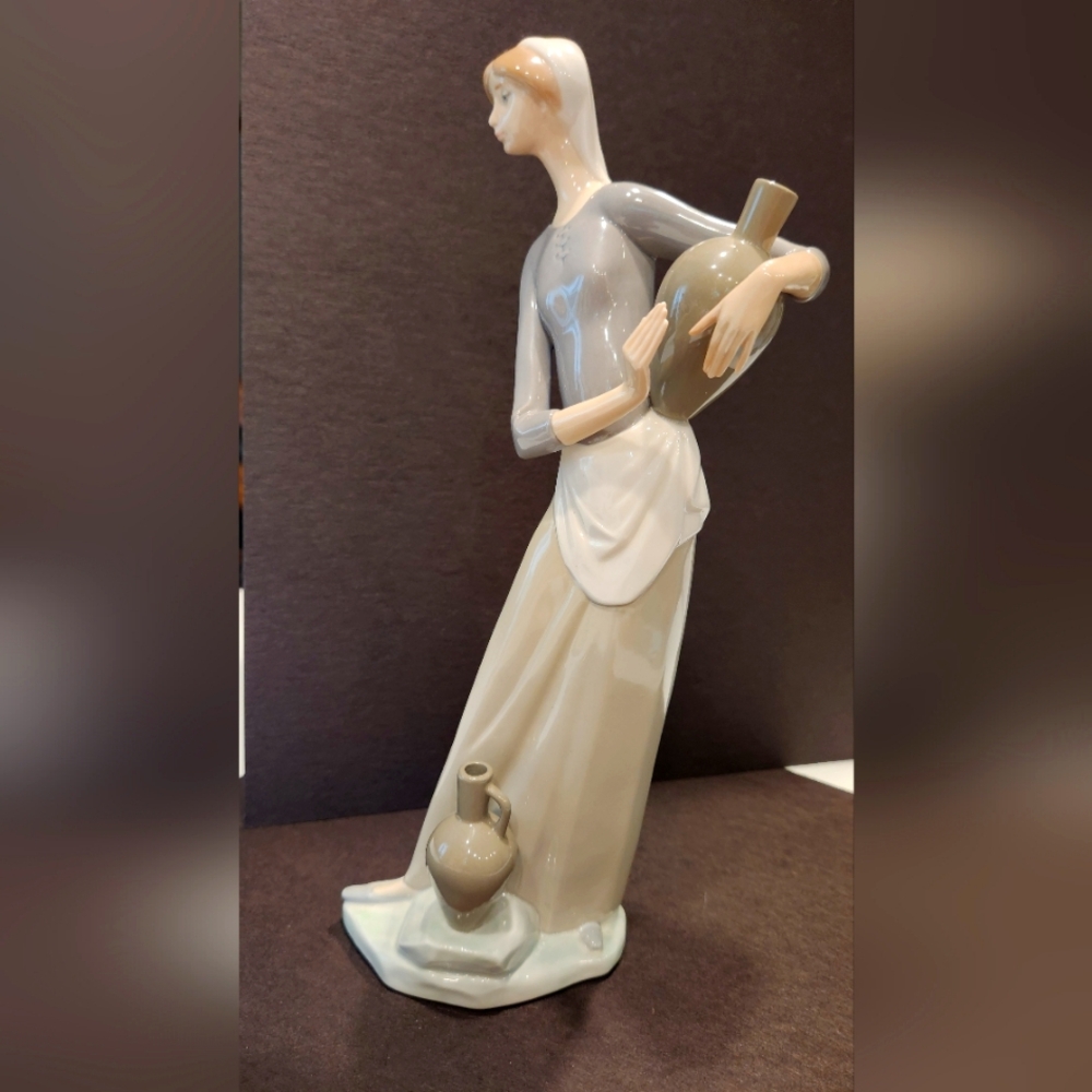 Lladro girl with jugs